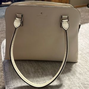 Kate Spade cream colored handbag.
